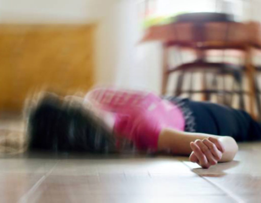 Woman lying on the floor at home, epilepsy, unconsciousness, faint, stroke, accident  or other health problem, healthcare and medical concept